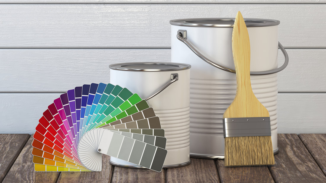 Paint brushes and color samples for choosing a room palette